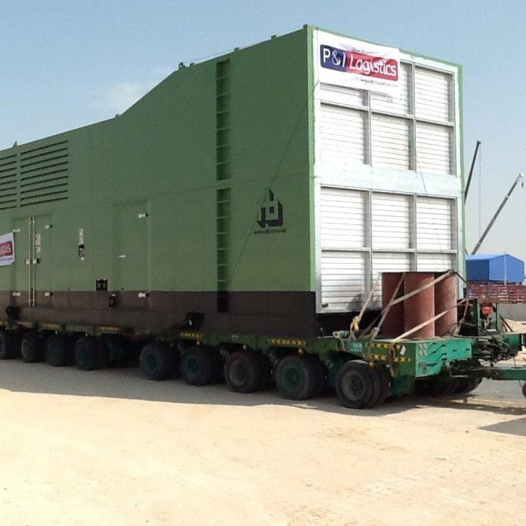 project logistics photo - 1 - Transportation of Generator sets from CAT (Al Bahar) yard using special trailer in Sharjah and delivery up to Abu Dhabi midfield airport site including offloading onto foundation